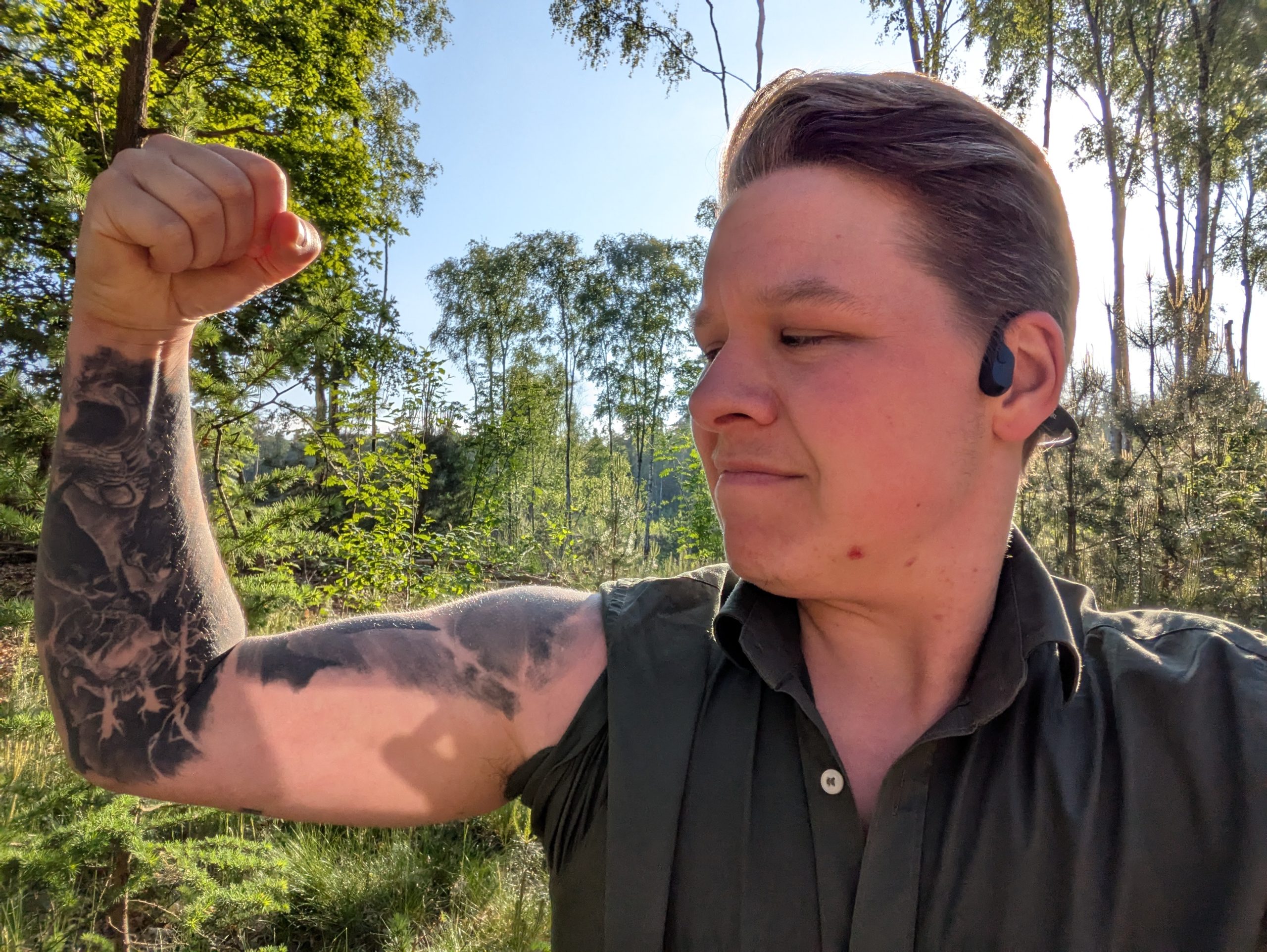 Picture of me pretending to be very strong and looking satisfied, in the forest